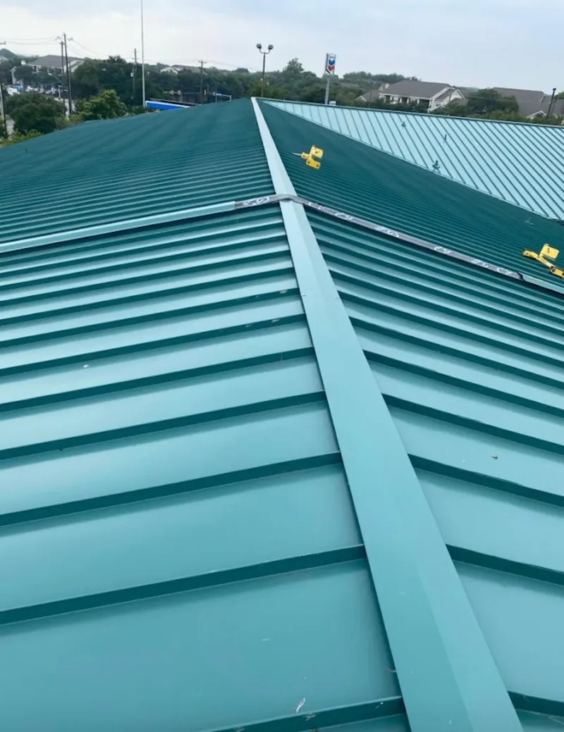 Green commercial metal roof ridge and valley for Metal Roof Repair in West Bradford